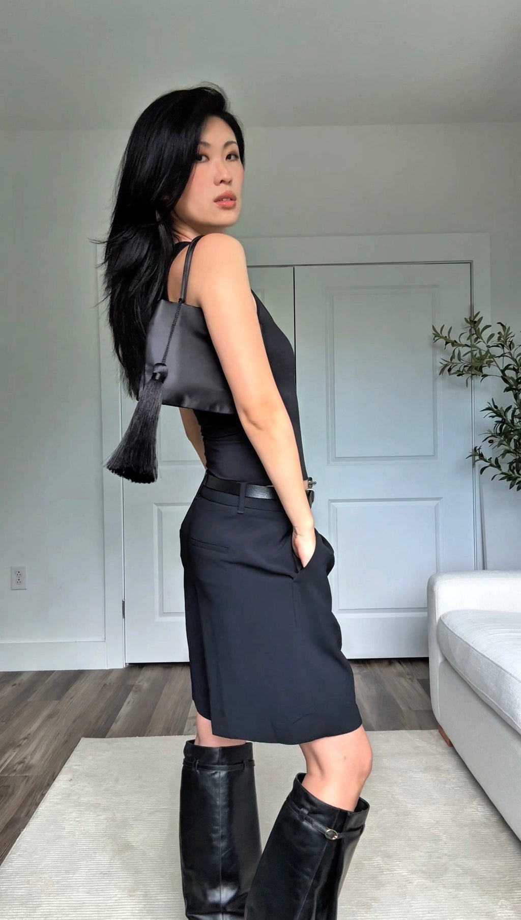 Minimalist Black Nylon Top Handle Bag with Statement Silk Tassel Accent