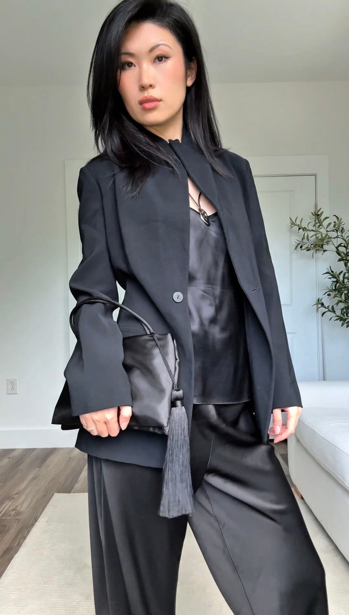 Minimalist Black Nylon Top Handle Bag with Statement Silk Tassel Accent